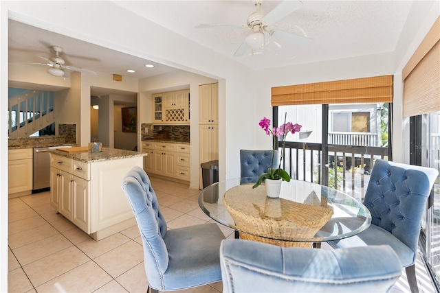 dining space with light tile patterned flooring, a ceiling fan, and recessed lighting