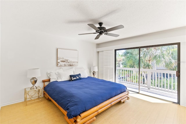 bedroom with a textured ceiling, a ceiling fan, baseboards, access to outside, and light wood-type flooring