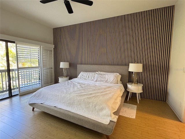 bedroom with access to exterior, ceiling fan, and light hardwood / wood-style floors