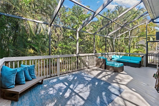 wooden terrace with glass enclosure and an outdoor hangout area