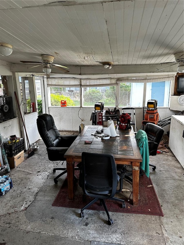 sunroom featuring ceiling fan