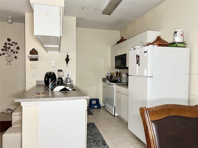 kitchen with white cabinets, sink, light tile patterned floors, and white appliances