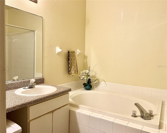 bathroom with vanity and plus walk in shower