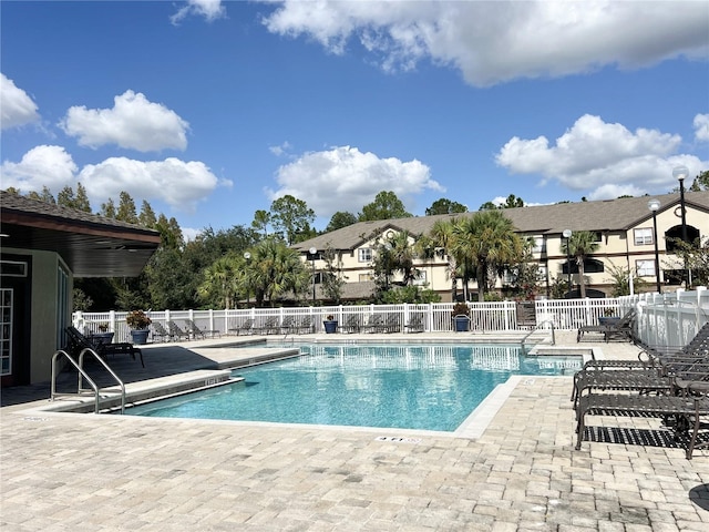 view of swimming pool with a patio area