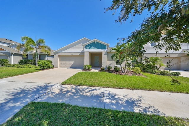 view of front of home featuring a front lawn and a garage