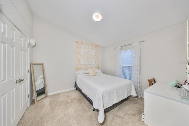 carpeted bedroom featuring vaulted ceiling