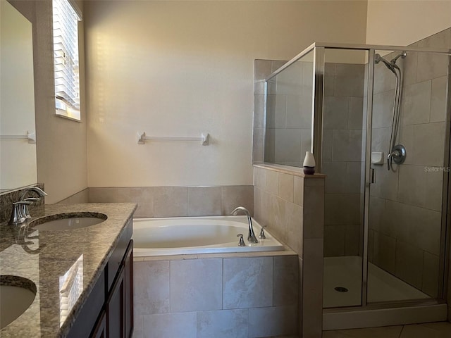 bathroom featuring vanity and plus walk in shower