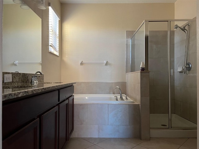 bathroom with vanity, separate shower and tub, and tile patterned flooring