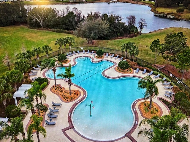 view of swimming pool featuring a water view