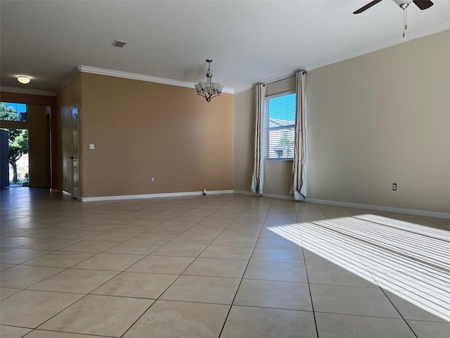 tiled spare room featuring crown molding and ceiling fan with notable chandelier