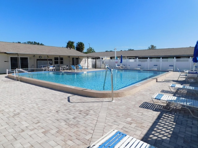 view of swimming pool with a patio