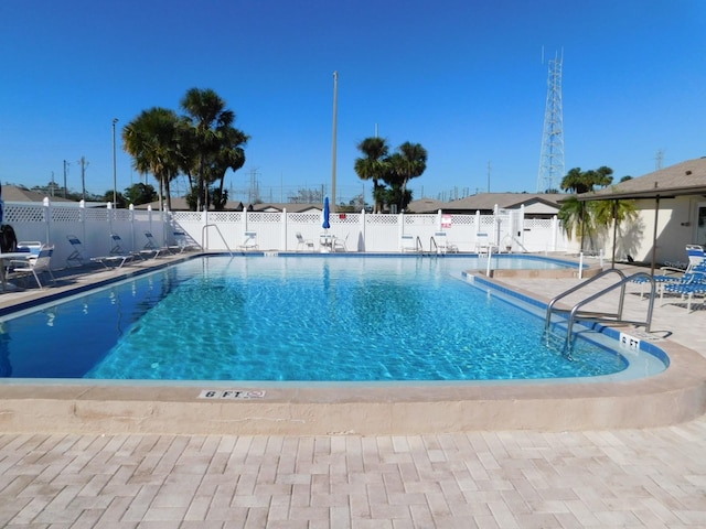 view of swimming pool with a patio