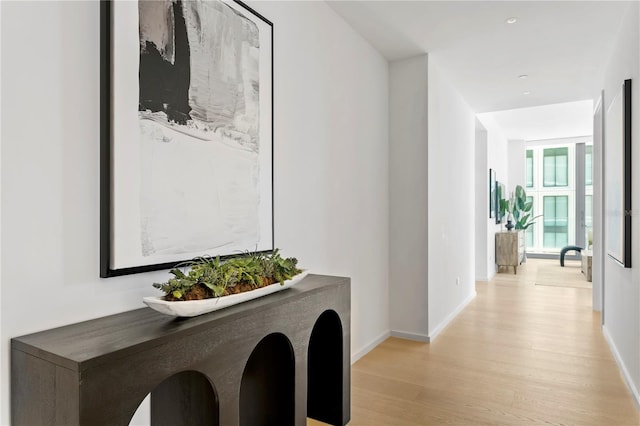 hall with light wood-type flooring