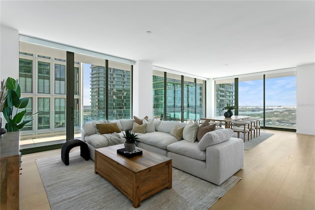 1000 Water St Unit 1402, Tampa, FL 33602 - living room featuring a wall of windows and wood finished floors