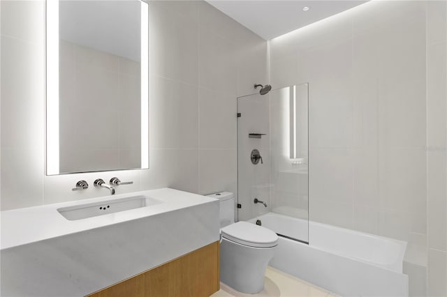 1000 Water St Unit 1402, Tampa, FL 33602 - bathroom featuring shower / tub combination, vanity, toilet, and tile walls