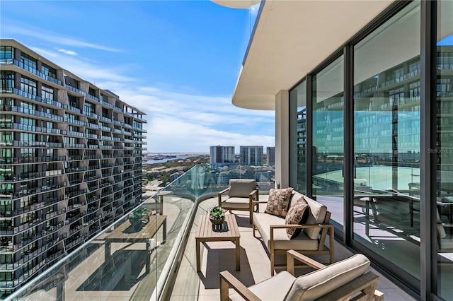 1000 Water St Unit 1402, Tampa, FL 33602 - balcony with a city view and an outdoor living space