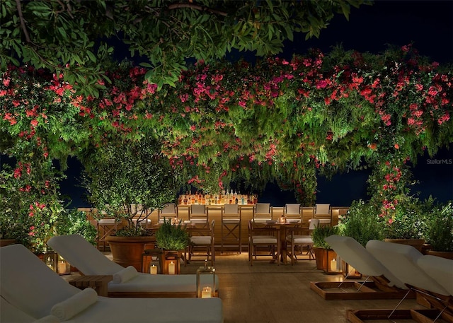 1000 Water St Unit 1402, Tampa, FL 33602 - patio at twilight featuring a patio area, outdoor dining space, and an outdoor hangout area