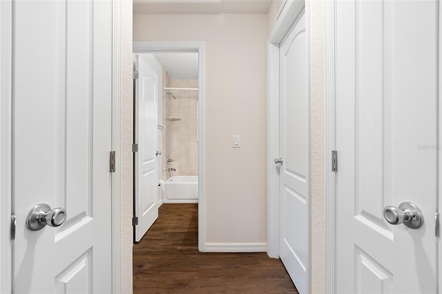 hall with dark wood-type flooring