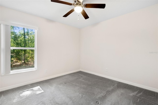 empty room with carpet floors and ceiling fan