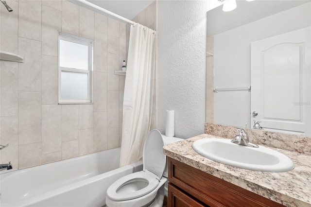 full bathroom with toilet, shower / bath combo, and vanity