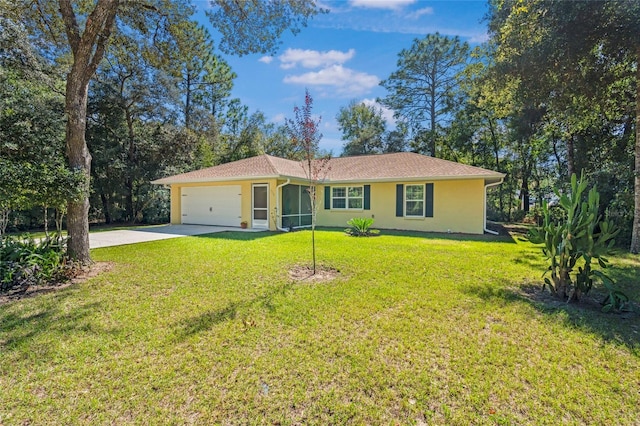 single story home featuring a garage and a front lawn