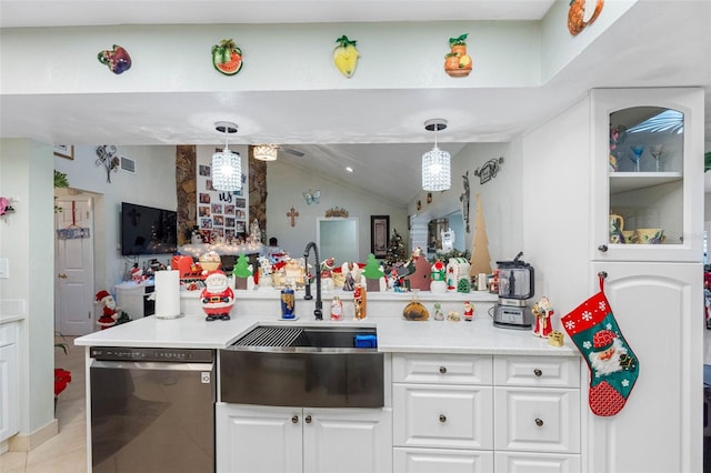 kitchen featuring sink, pendant lighting, black dishwasher, white cabinetry, and lofted ceiling