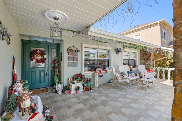 doorway to property featuring covered porch