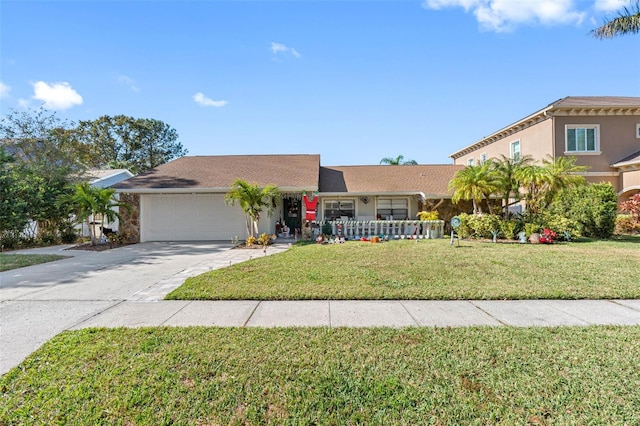 view of front of property featuring a garage and a front lawn