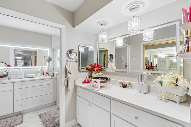 bathroom with tile patterned floors and vanity