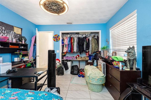 bedroom featuring visible vents and a closet