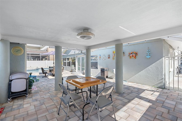 view of patio / terrace featuring outdoor dining area and a fenced in pool