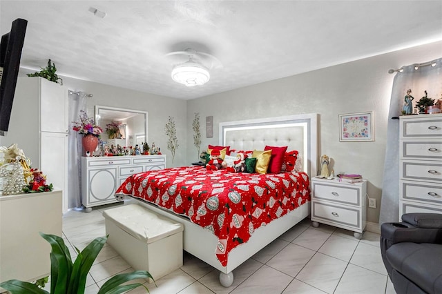 bedroom with light tile patterned floors