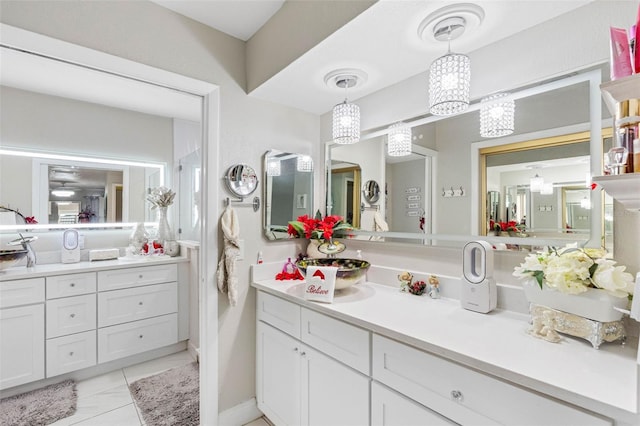 bathroom with tile patterned flooring and vanity