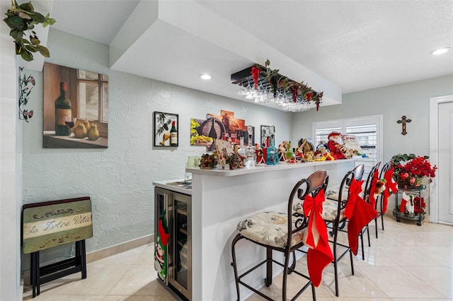 4608 Apple Ridge Ln, Tampa, FL 33624 - indoor dry bar with a textured wall, tile patterned flooring, recessed lighting, and baseboards