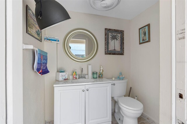 4608 Apple Ridge Ln, Tampa, FL 33624 - half bath featuring toilet, vanity, and tile patterned flooring