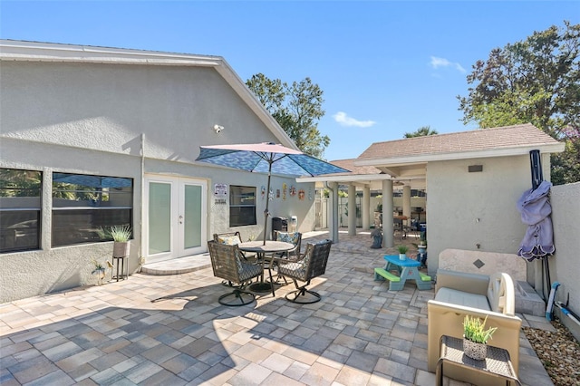 4608 Apple Ridge Ln, Tampa, FL 33624 - view of patio / terrace featuring french doors, outdoor dining area, and an outdoor hangout area