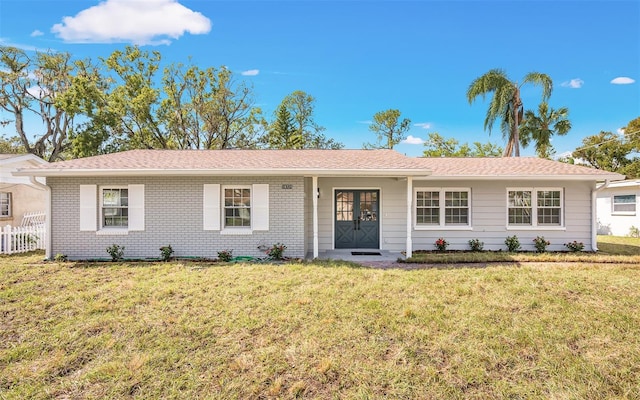 single story home featuring a front yard