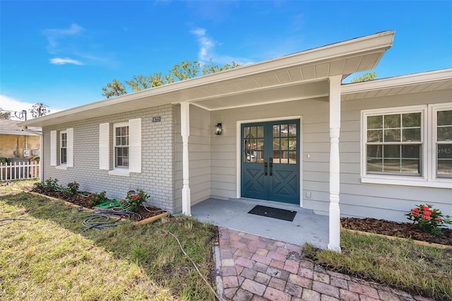 entrance to property featuring french doors