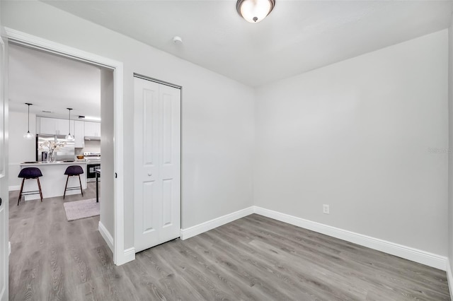 unfurnished room featuring light hardwood / wood-style flooring