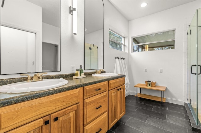 bathroom with vanity, tile patterned floors, and a shower with door