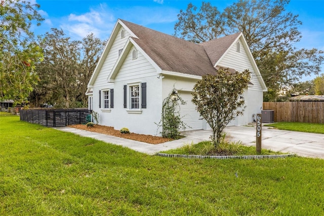 view of property exterior featuring central air condition unit and a lawn