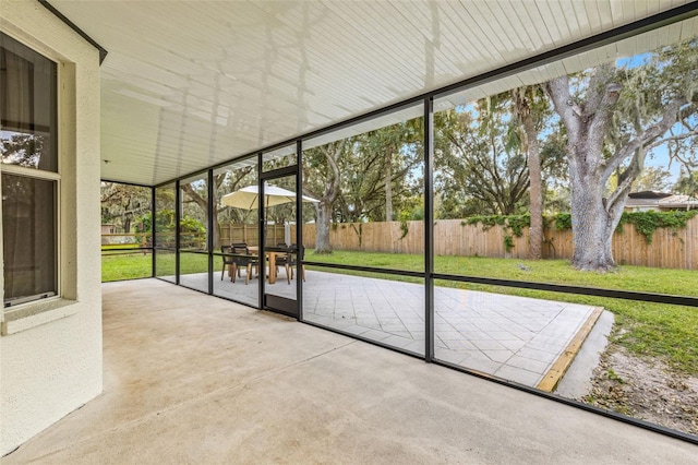 unfurnished sunroom featuring a healthy amount of sunlight