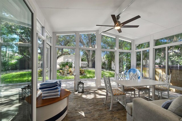 sunroom / solarium with wood finished floors and expansive windows