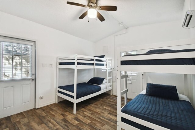 bedroom featuring dark wood-style floors, vaulted ceiling, ceiling fan, and baseboards