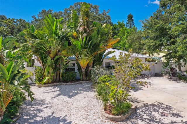 exterior space featuring fence and driveway