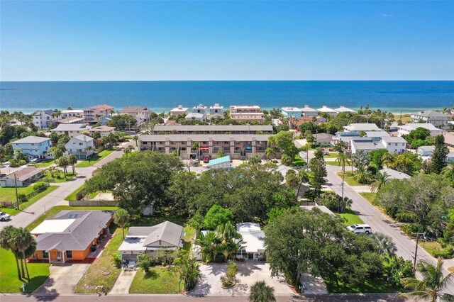 aerial view of residential area featuring a nearby body of water