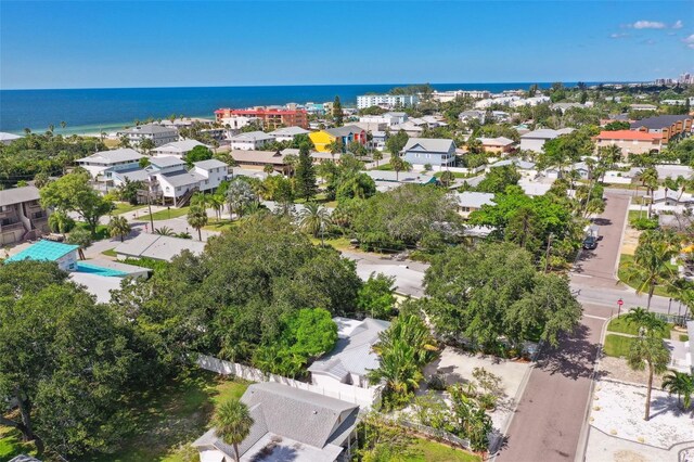 aerial view of residential area with a large body of water