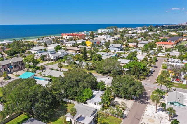 aerial view of residential area featuring a nearby body of water