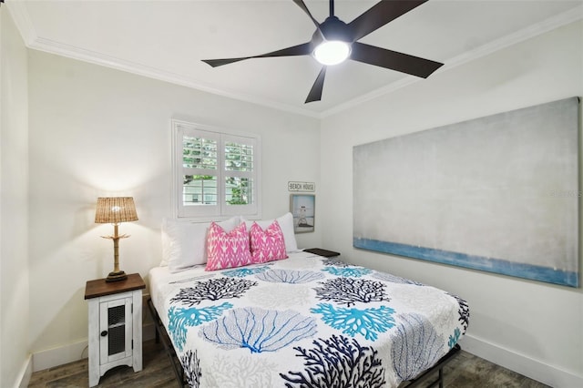 bedroom with baseboards, ornamental molding, ceiling fan, and wood finished floors