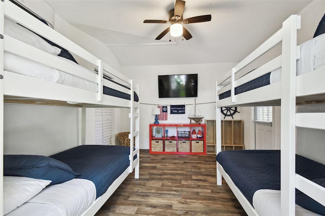 bedroom with lofted ceiling and wood finished floors